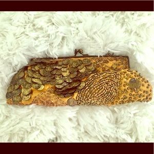Coin purse...made with coins.  Gold in color
